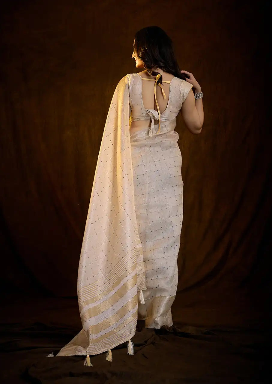 Indo Silk Cream White Sarees Crafted With A Blend Of Linen And Silk Offer A Unique Combination Of Texture And Elegance