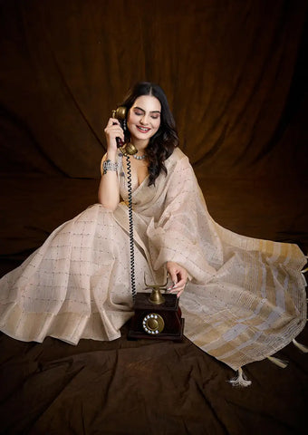 Indo Silk Cream White Sarees Crafted With A Blend Of Linen And Silk Offer A Unique Combination Of Texture And Elegance