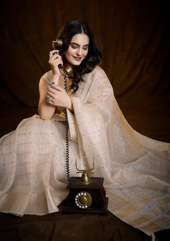 Indo Silk Cream White Sarees Crafted With A Blend Of Linen And Silk Offer A Unique Combination Of Texture And Elegance