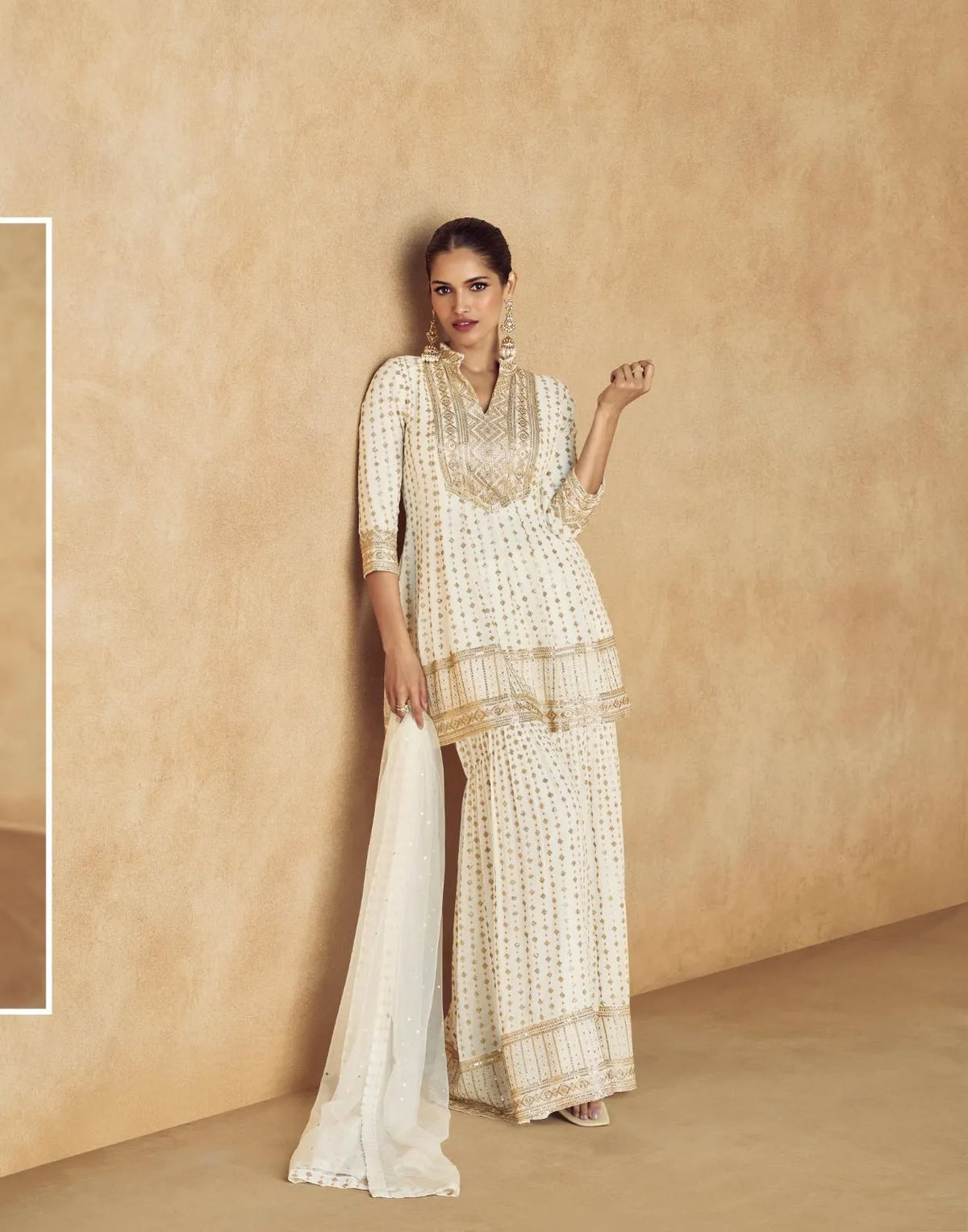 Graceful Ivory Pure Georgette Sharara Suit with Golden Embroidery